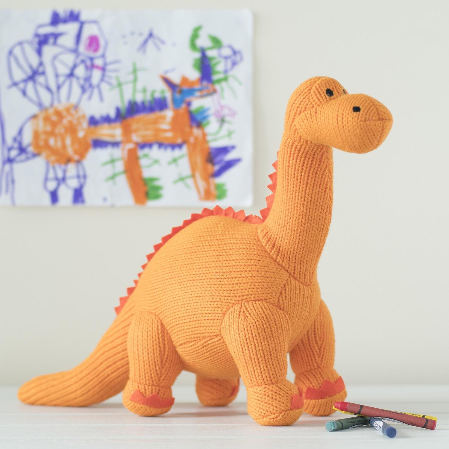 orange dinosaur soft toy